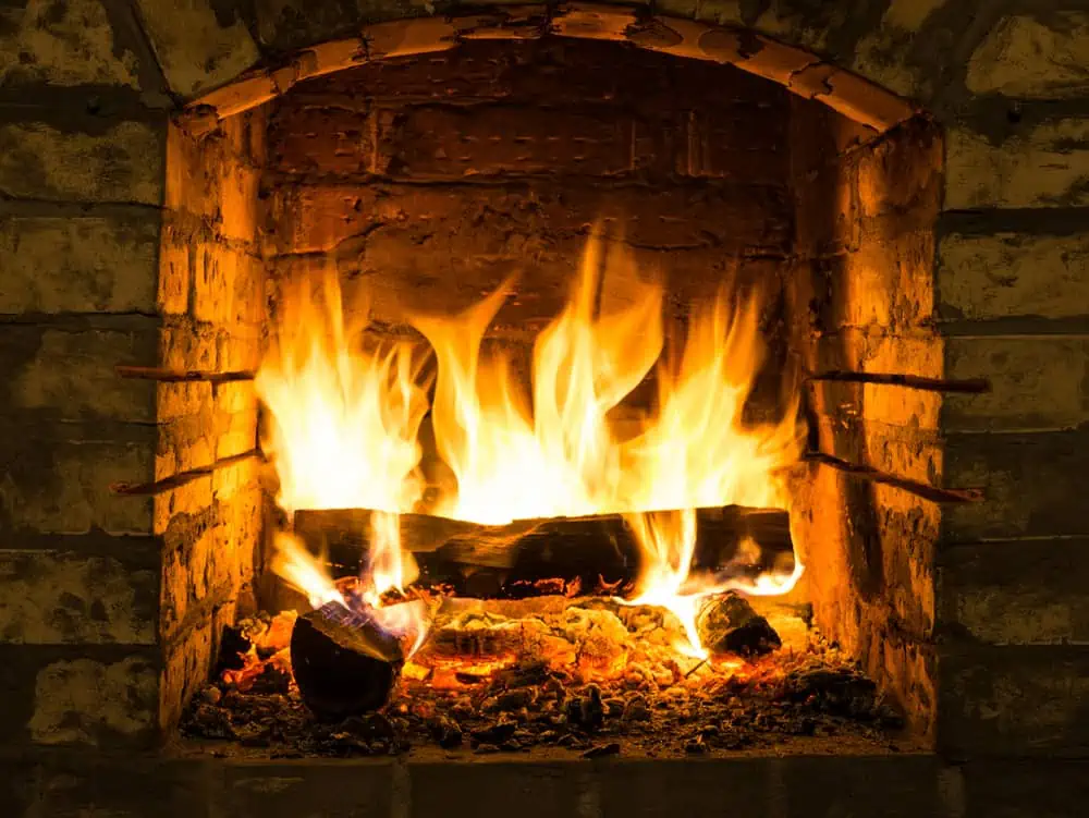 Burning,Firewood,In,Fire-box,Of,Fireplace,In,Country,Cottage.,Rustic