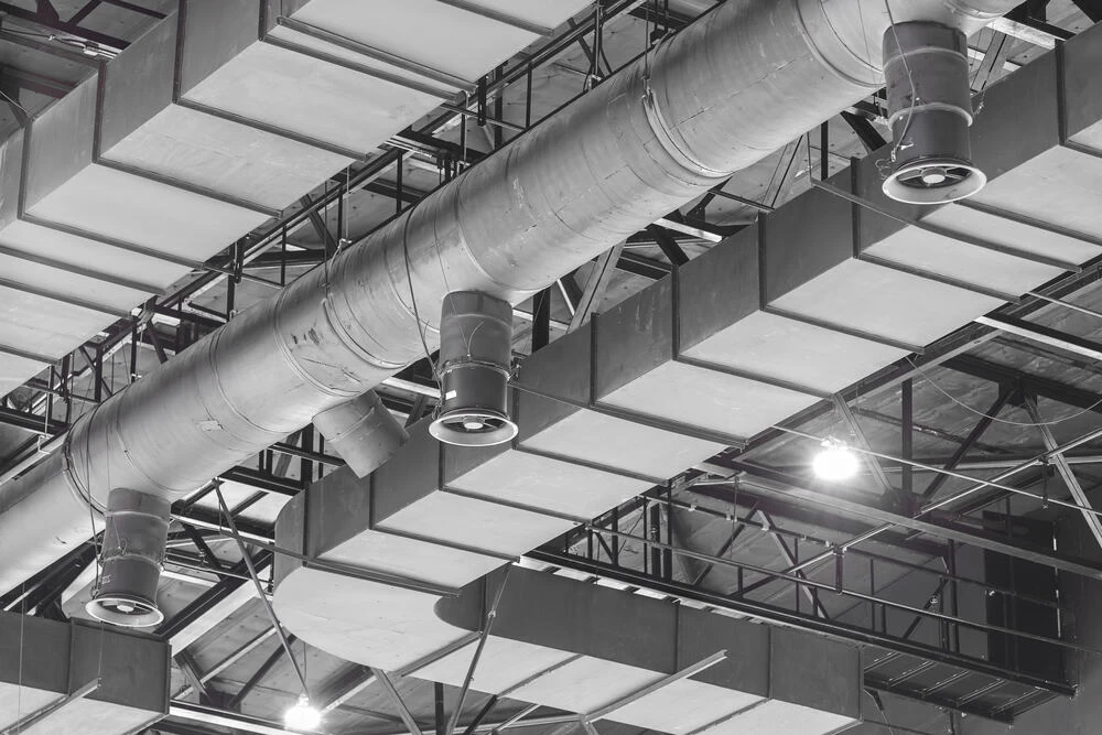ceiling with commercial air ducts.
