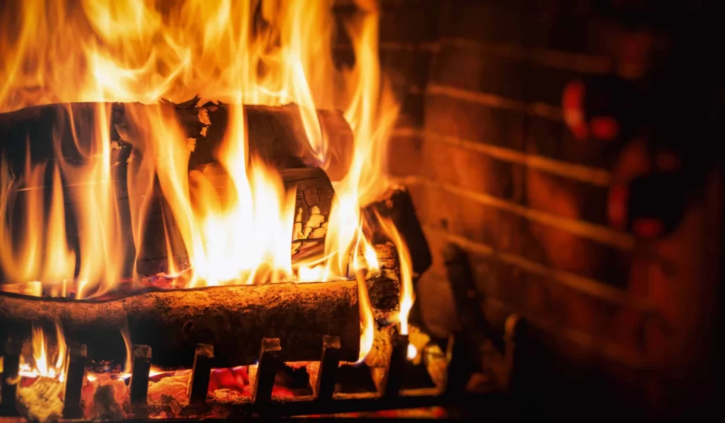 A close up of a fire in a fireplace.