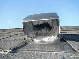 A roof vent with a hole in it.