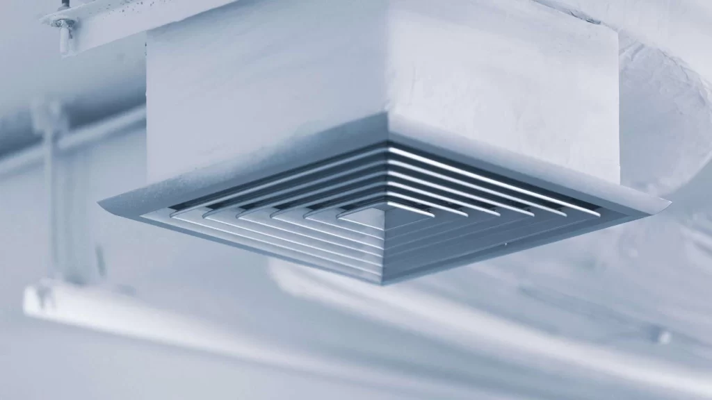 A close up of a metal ceiling vent.