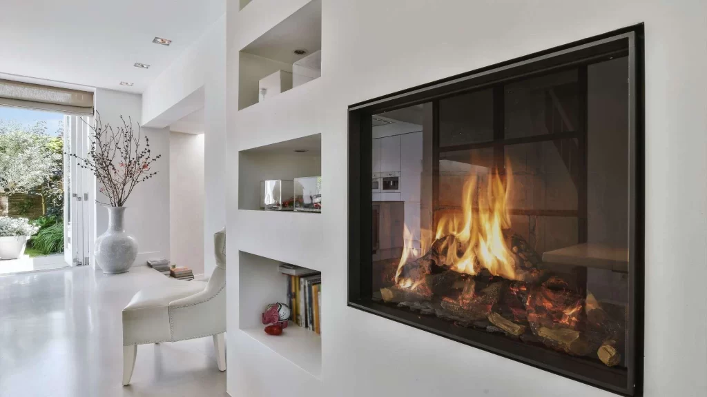 A fireplace in a modern home with white walls.