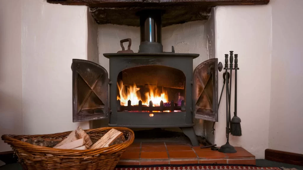A wood burning stove in a room.