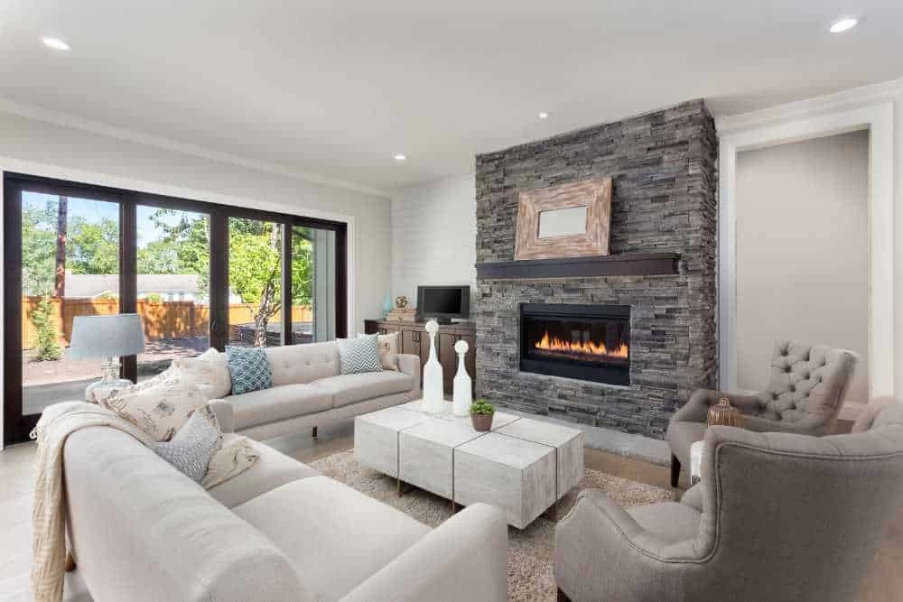 This image showcases a beautifully maintained interior fireplace, emphasizing the importance of regular chimney inspections and cleanings.